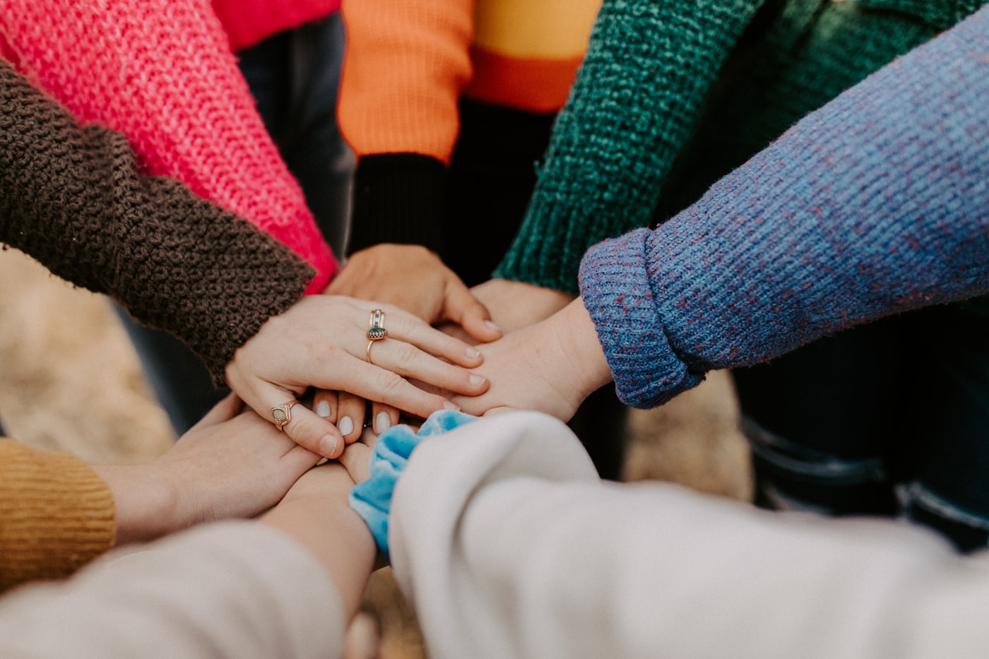 Diverse community members and healthcare workers in warm light